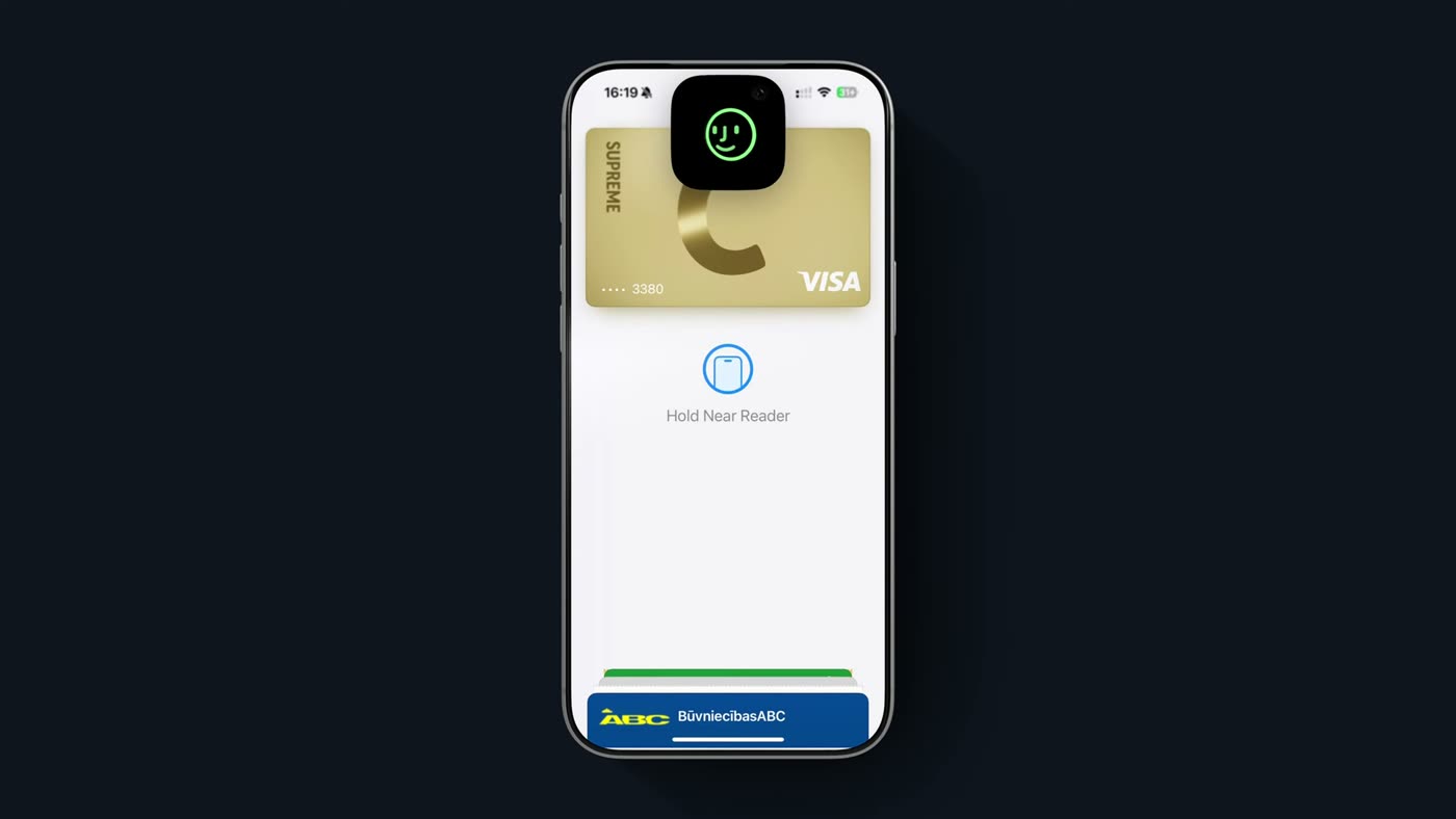 An iPhone Wallet screen with a gold fish-scale pass in the stack above the usual bank cards.