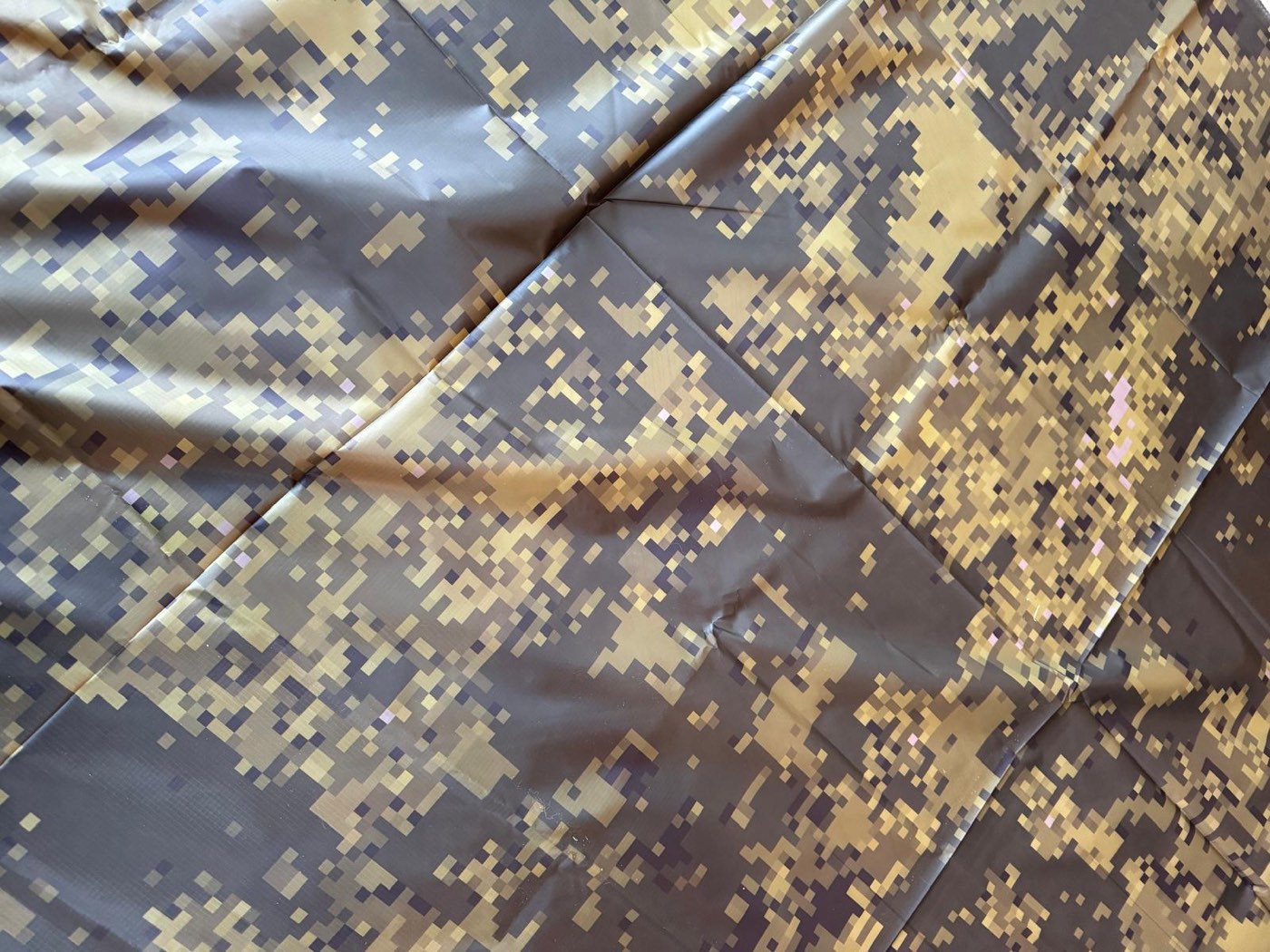 The printed material laid out flat, showing the pixel blotches at their final scale.